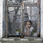 Girl Staring Out of a Window